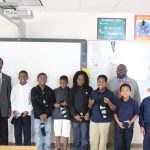 The students with Bros. Archie Course (left) and Derek Wilson (right)