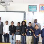 The students with Bros. Archie Course (left) and Derek Wilson (right)
